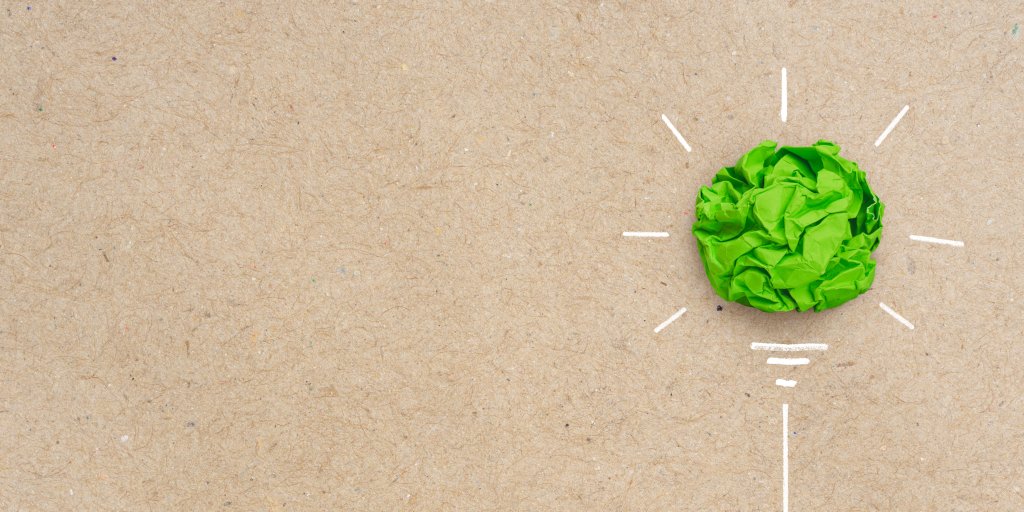 Green crumpled paper light bulb, Corporate Social Responsibility (CSR), eco-friendly business and environmental concept with copy space