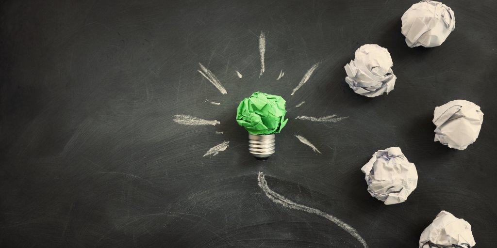 Concept image if green crumpled paper lightbulb, symbol of scr, innovation and eco friendly business