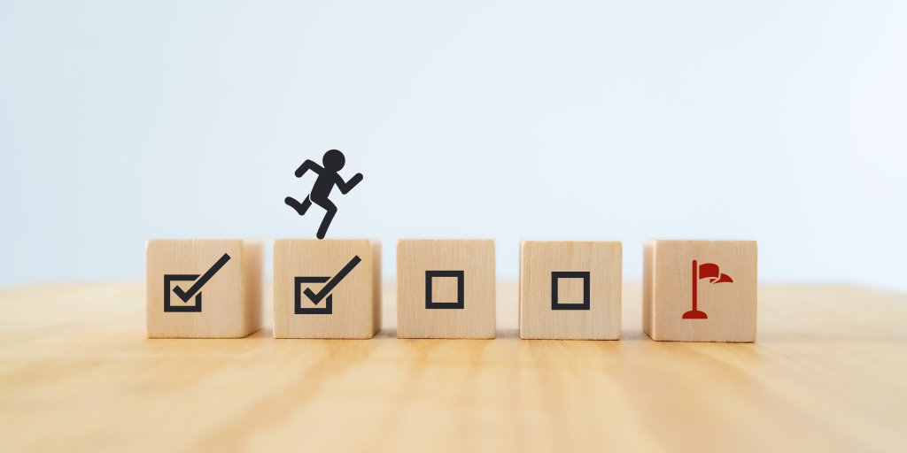 Work in progress concept. Goals, targets, tasks tracking. Goals achievement and business success.  Task completion. Managing project timeline. Wooden blocks with target achievement icon.